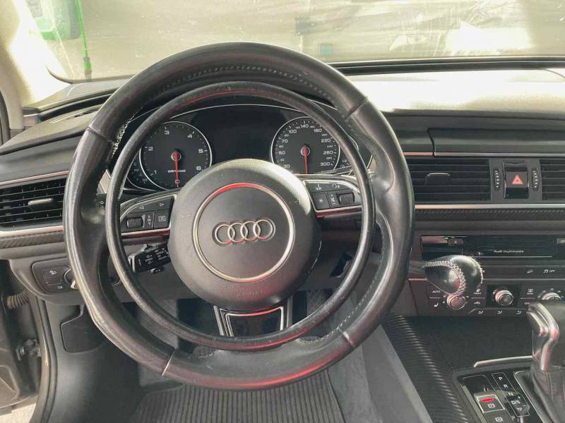 Audi A6 en vente dans l'Hérault 34 avec poste de conduite paraplégique, accélérateur par cercle sur volant et levier de frein à baisser Kempf par Handi Conduite