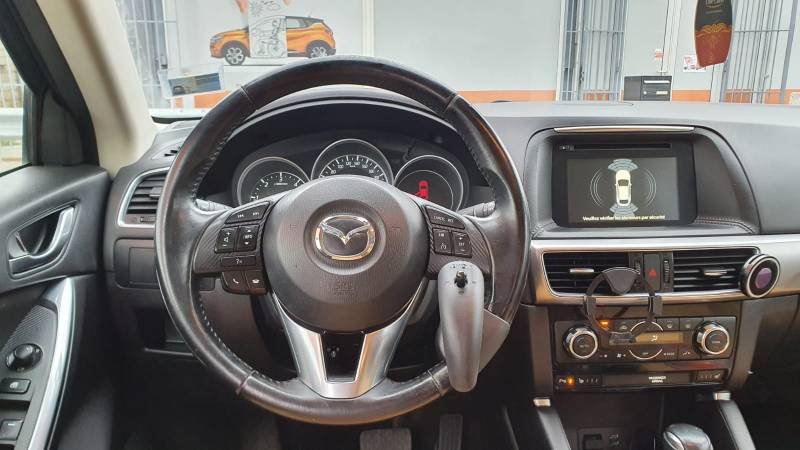 Adaptation PMR au poste de conduite avec télécommande multifonctions Joy Control au volant sur Mazda CX5 par Handi Conduite à Montpellier