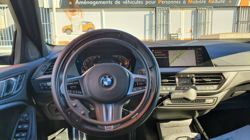Aide à la conduite pour personne handicapée sur BMW avec accélérateur par cercle sur volant et levier de frein à pousser par Handi Conduite à Perpignan